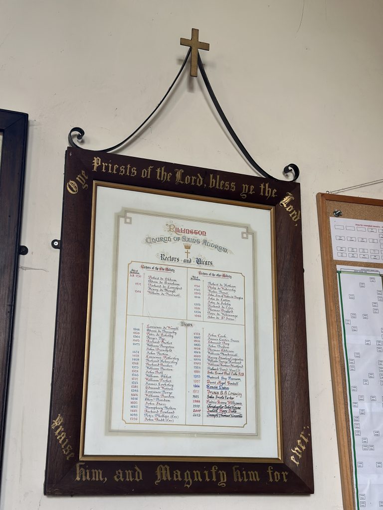 Board listing the rectors and vicars of St. Andrew's Church, Rillington.